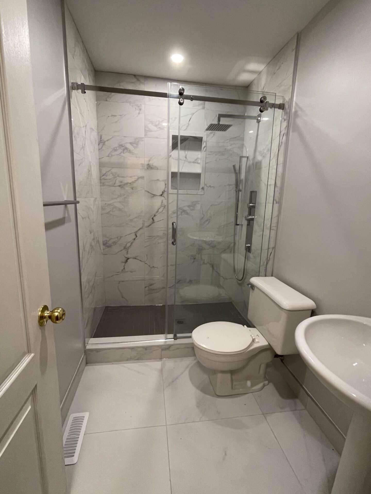 about bathtub to shower 1' x 2' carrara porcelain shower renovation, Bathtub To Shower Conversion
