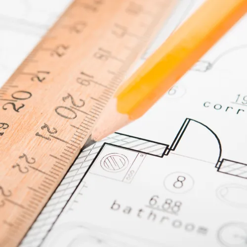 An important blueprint with a ruler and pencil.